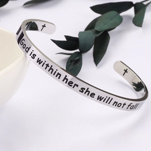 Detail of engraved inspirational quote on polished 6mm stainless steel open cuff bracelet
