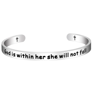 Macro detail of silver stainless steel cuff bracelet with engraved inspirational quote