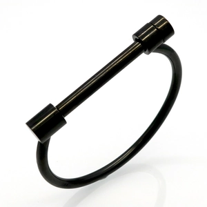 Industrial matte black stainless steel D-shape screw cuff bracelet on white background