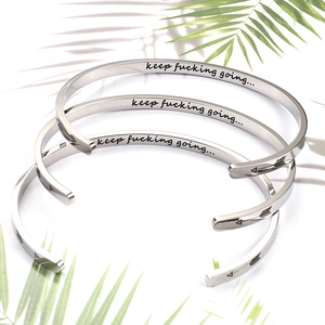 Polished stainless steel inspirational cuff bracelet with engraved quote and arrow details