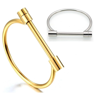 Detailed close-up of gold and silver horseshoe D-shaped stainless steel bangles