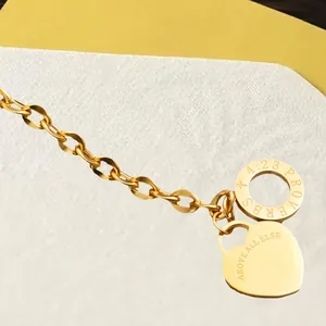 Gold plated stainless steel bracelet with engraved Proverbs 4:23 heart charm and OT clasp