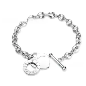Close-up of stainless steel chain bracelet with OT toggle and Proverbs 4:23 engraving