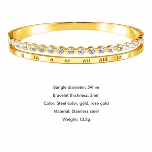Detail view of Roman numerals and zircon inlay on a gold stainless steel bangle
