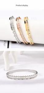 Detailed macro view of silver Roman numeral engraved bracelet with inset sparkling rhinestones