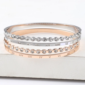 Set of four Roman numeral bracelets with crystal inlay in silver and rose gold finishes