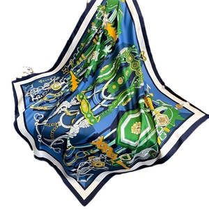 Classic 90cm square silk scarf featuring chain patterns and equestrian motifs in deep blue