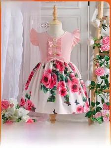 Detailed view of pink ribbed knit bodice with wood buttons and floral printed skirt