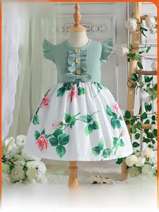 Detail of baby girl floral dress featuring green ribbed bodice and wooden buttons