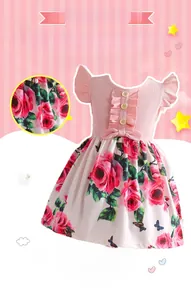 Detail of pink ribbed knit top with flutter sleeves and floral rose print skirt on girl dress
