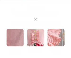 Detail of pink ribbed cotton girl dress with wooden buttons and waist bow decoration