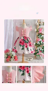 Detail of pink ribbed knit bodice with frill sleeves and rose print floral skirt