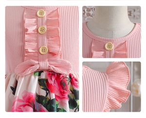 Detail view of pink ribbed knit bodice with wood buttons and floral print skirt