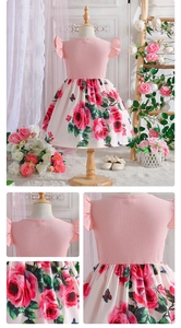 Detailed views of girls' knit pink top and white floral skirt with red rose prints