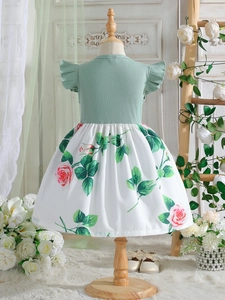 Sage green ribbed knit dress for girls with flutter sleeves and rose print skirt back view