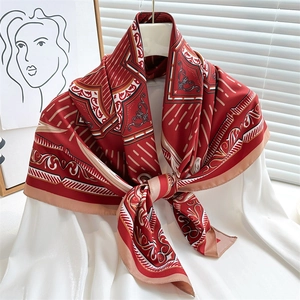 Baroque red and beige silk scarf styled on a white shirt with geometric pattern print