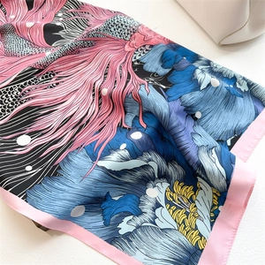 Silk-textured square scarf with koi and peony floral prints on a minimalist background