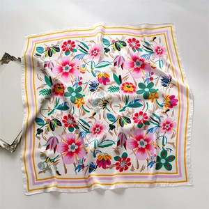 Floral geometric print silk square scarf with colorful blossoms and a pink border