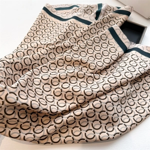 Elegant 90cm silk scarf with brown chain link print and dark green border detail