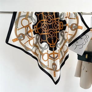 Detail of vintage chain and horse harness print on large silk-like square scarf