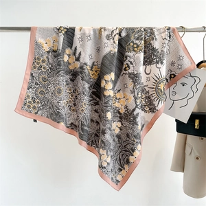Detail of silk scarf with floral sun patterns displayed in a high-end fashion boutique