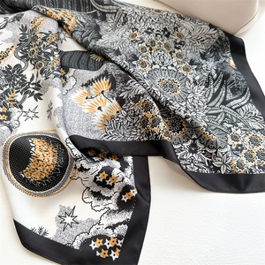 Detail of sunflower twill silk scarf with mandala patterns and black border design