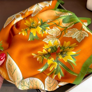 Bright orange floral silk scarf with yellow sunflowers and green edges, 70cm square wrap