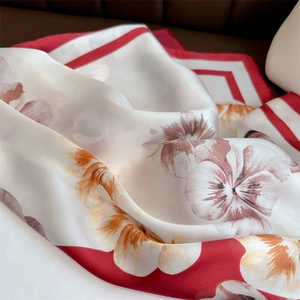 Floral print silk square scarf with red border and elegant botanical patterns