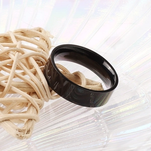 Minimalist 6mm black polished stainless steel ring with a smooth mirror finish
