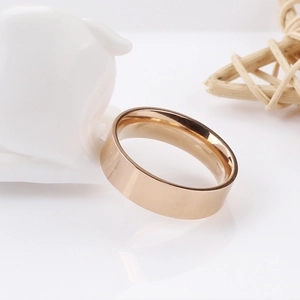 Polished rose gold stainless steel ring with 45-degree angle showing mirror finish