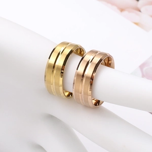Detail of matte and polished stainless steel rings in gold and rose gold finishes