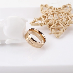 Macro shot of rose gold titanium ring with brushed finish and dual line design