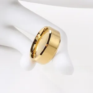 Detail of gold-plated wide band ring featuring brushed exterior and polished inner surface