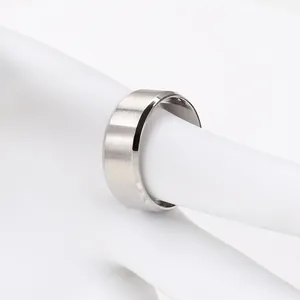 Close-up of silver brushed steel ring with polished beveled edges and minimalist design