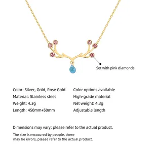 Golden moose antler necklace with pink crystal and blue water drop pendant in titanium steel