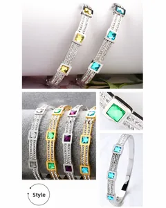 Detail of square-cut colorful gemstones and pave-set crystals on titanium steel bangles