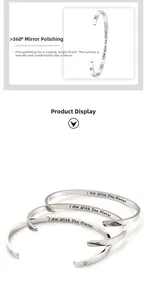 Detailed macro view of polished stainless steel cuff with I Am With You Always engraving