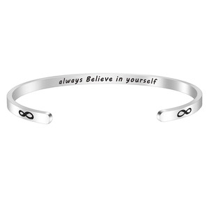 Silver infinity bangle with 'Always Believe in Yourself' engraving on open stainless steel