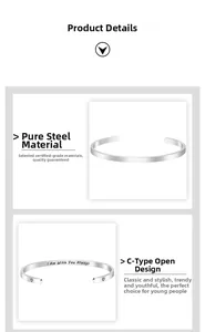 Detailed macro view of polished C-shaped steel cuff featuring I Am With You Always engraving