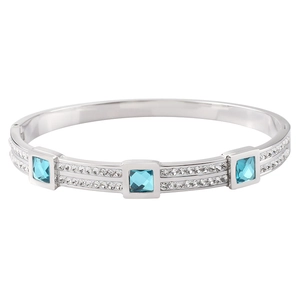 Close-up of square blue stones and pave crystals on silver stainless steel bangle