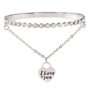 Detailed macro view of silver steel bracelet with zircon inlay and I Love You heart charm