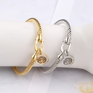 Twisted cable tree of life bangles in gold and silver finish with sparkling crystals