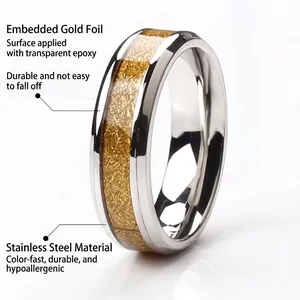 Polished stainless steel ring with 18k gold foil inlay and clear resin protective coating