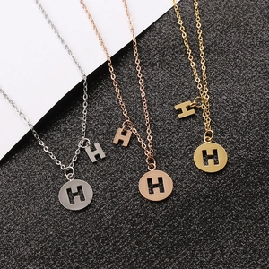 Sleek stainless steel H pendant necklaces in silver, gold, and rose gold finishes