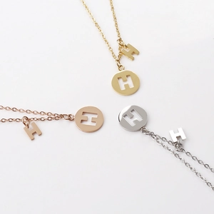 Polished stainless steel necklace set with H letter circular hollow pendant in three colors