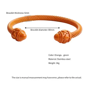 Orange twisted cable cuff bracelet in stainless steel with bead ends and 60mm diameter