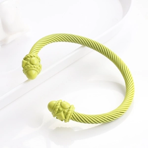 Neon green twisted cable cuff bracelet in stainless steel with textured end caps