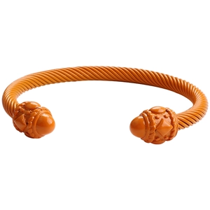 Detailed close-up of orange twisted cable cuff bracelet with embossed spherical end caps