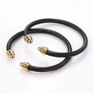 Adjustable twisted cable wire bracelets with gold and silver tone end caps
