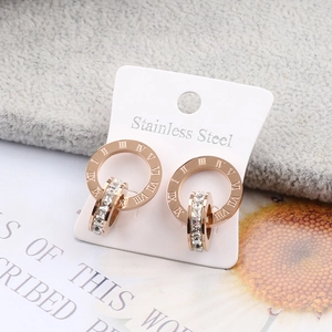 Rose gold stainless steel roman numeral stud earrings with pavé diamond accents
